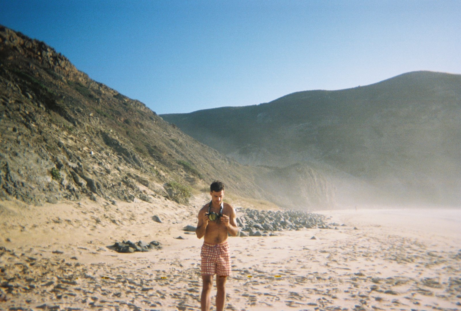 Manuel Cardoso Pinto with a camera on the beach